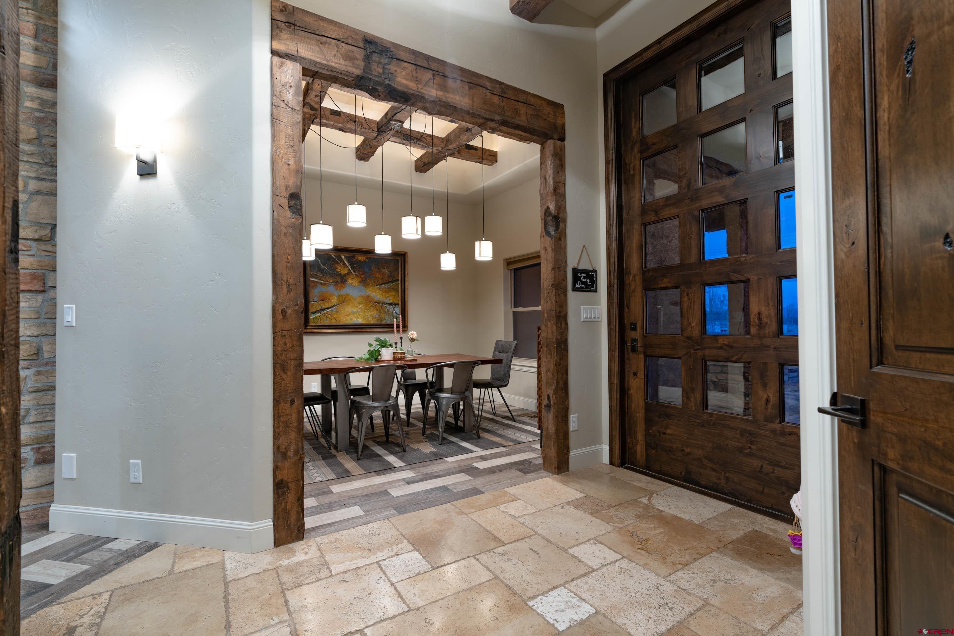 1988 J Road Fruita, CO 81521 - Photo 2 of 35 a view of a hallway with dining area and entryway