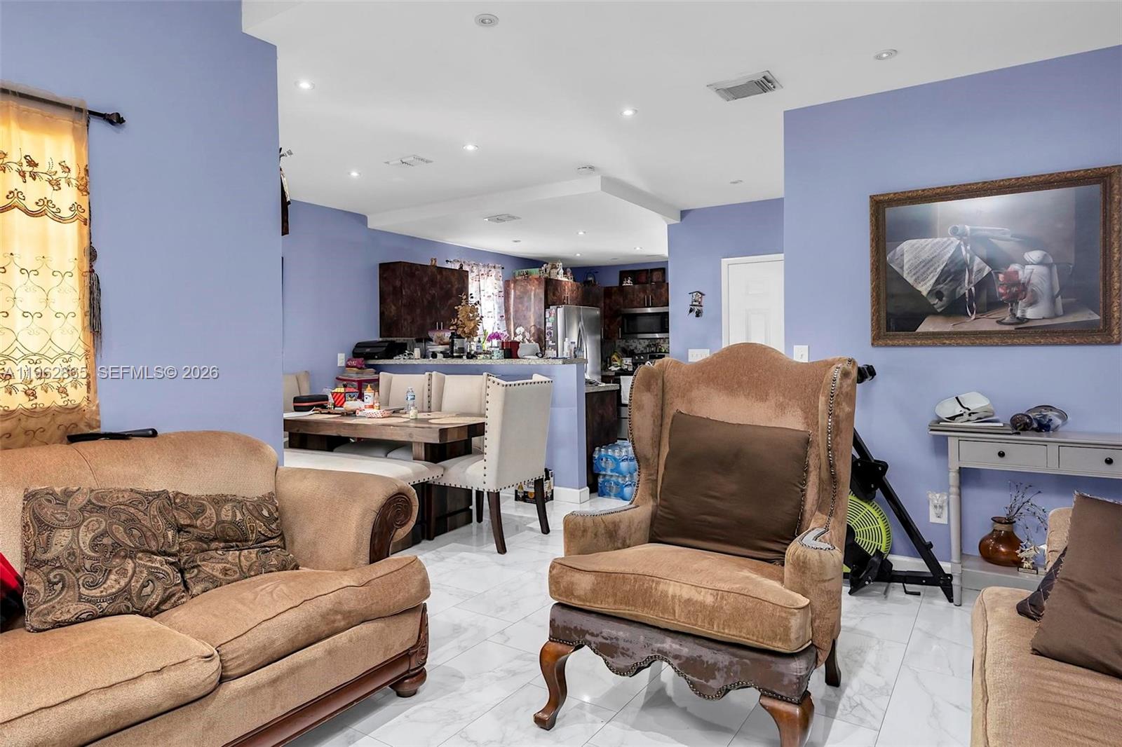 12201 Southwest 194th Terrace Miami, FL 33177 - Photo 14 of 34 a living room with furniture and a flat screen tv