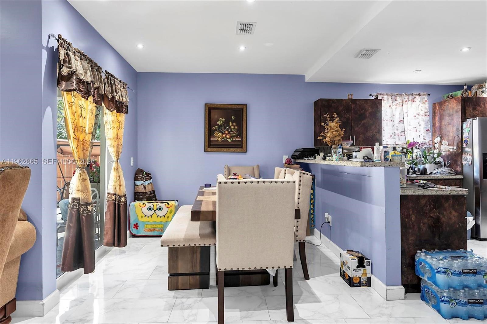 12201 Southwest 194th Terrace Miami, FL 33177 - Photo 16 of 34 a dining room with furniture and window