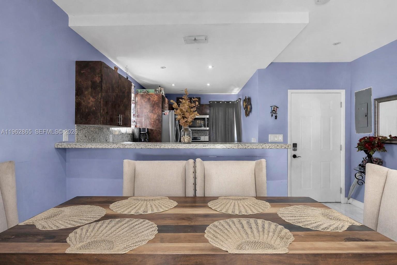 12201 Southwest 194th Terrace Miami, FL 33177 - Photo 18 of 34 a bedroom with a bed and a mirror