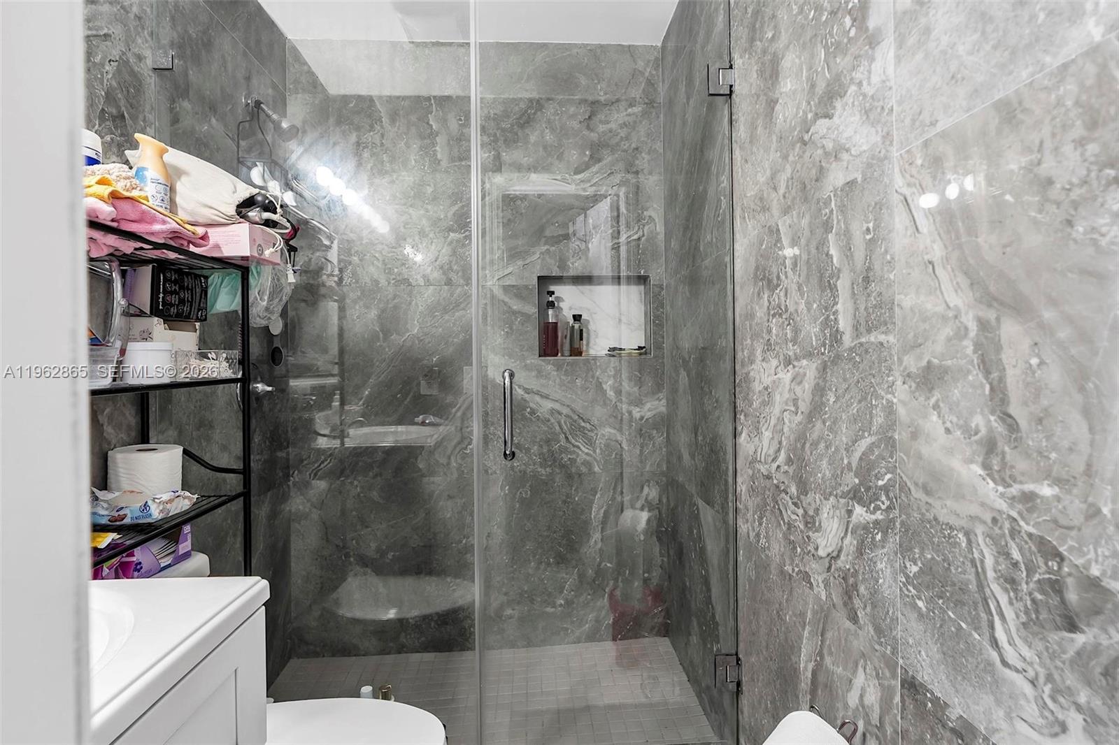 12201 Southwest 194th Terrace Miami, FL 33177 - Photo 24 of 34 a bathroom with a shower and toilet