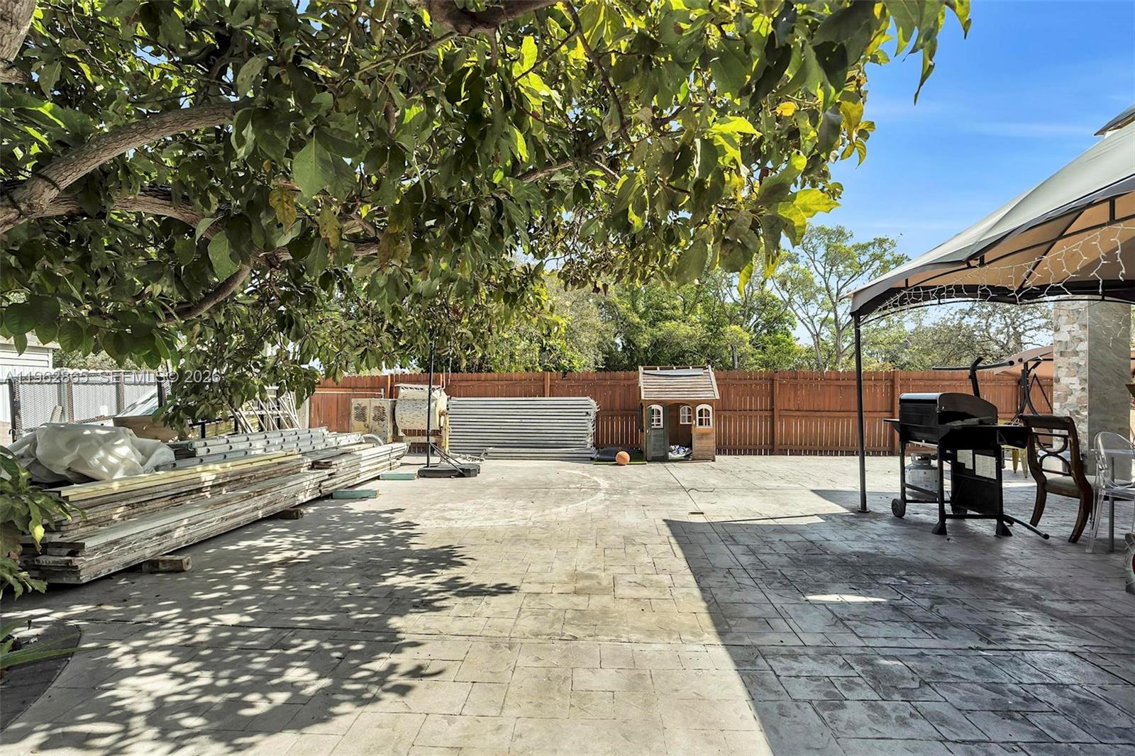 12201 Southwest 194th Terrace Miami, FL 33177 - Photo 30 of 34 a view of a backyard with sitting area