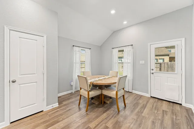 a kitchen with kitchen island a counter top space wooden floor and appliances