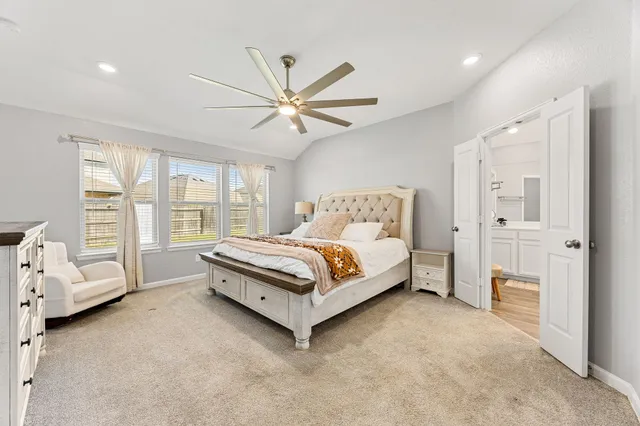a view of a dining room with furniture and a kitchen