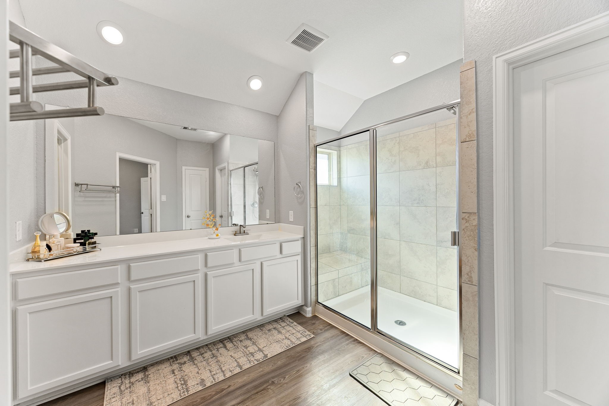 23002 Blackstone Park Road Katy, TX 77493 - Photo 20 of 36 a spacious bathroom with a shower a sink and mirror