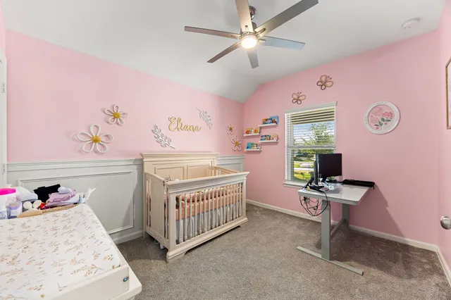 a spacious bathroom with a shower a sink and mirror