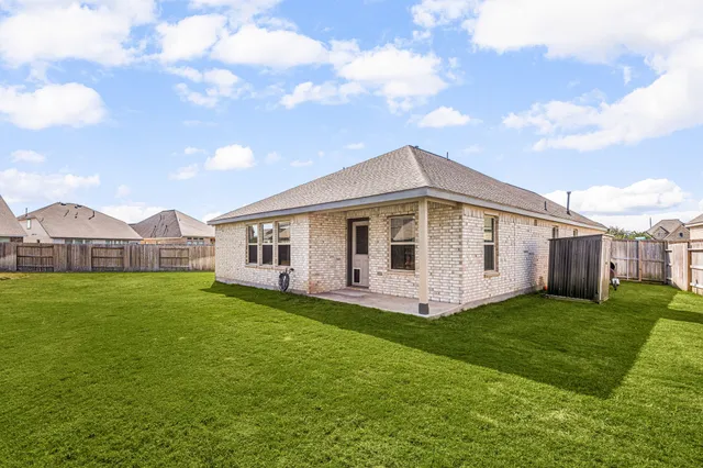 a view of a house with backyard porch and garden