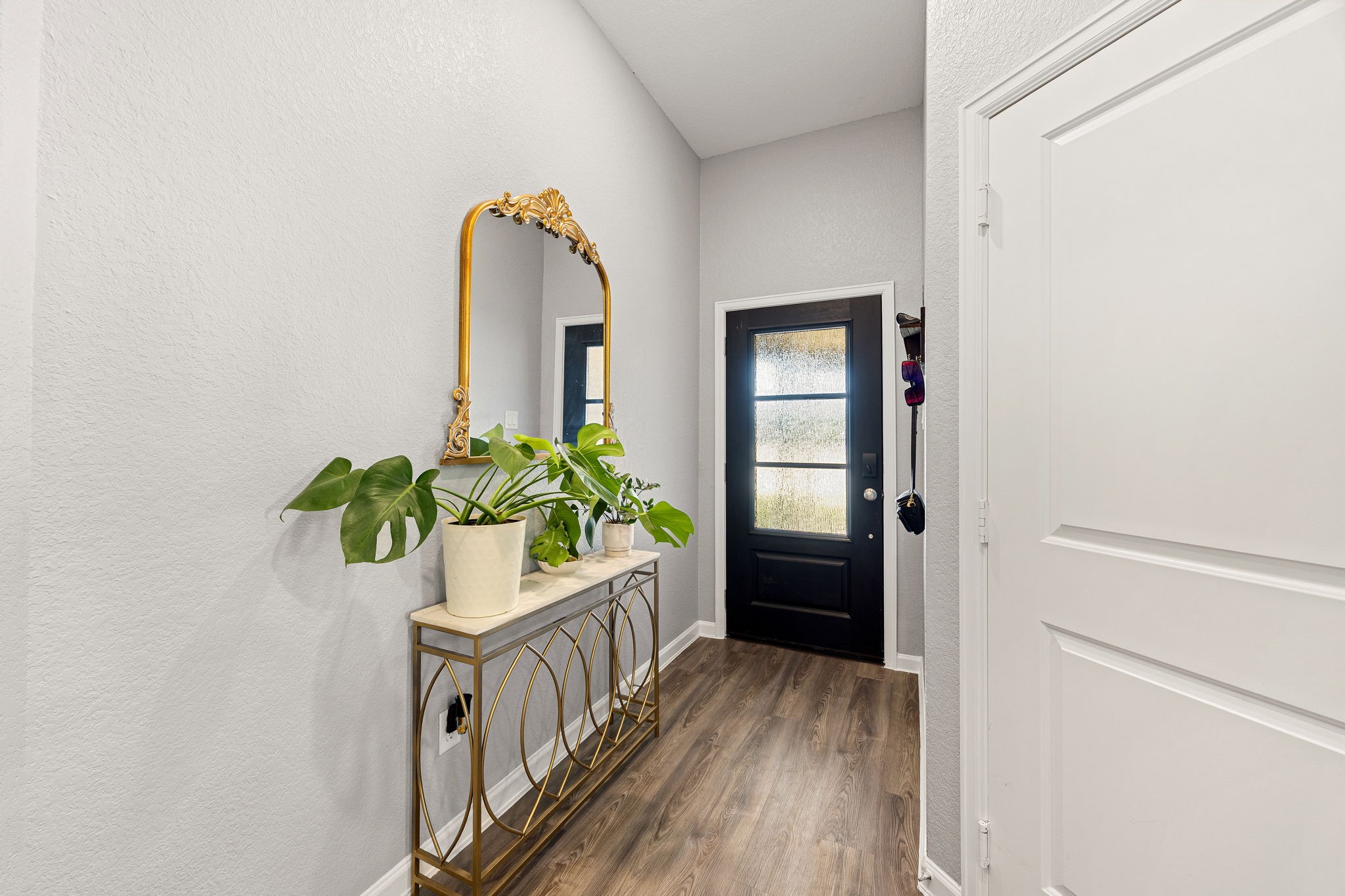 23002 Blackstone Park Road Katy, TX 77493 - Photo 5 of 36 a view of an entryway with wooden floor