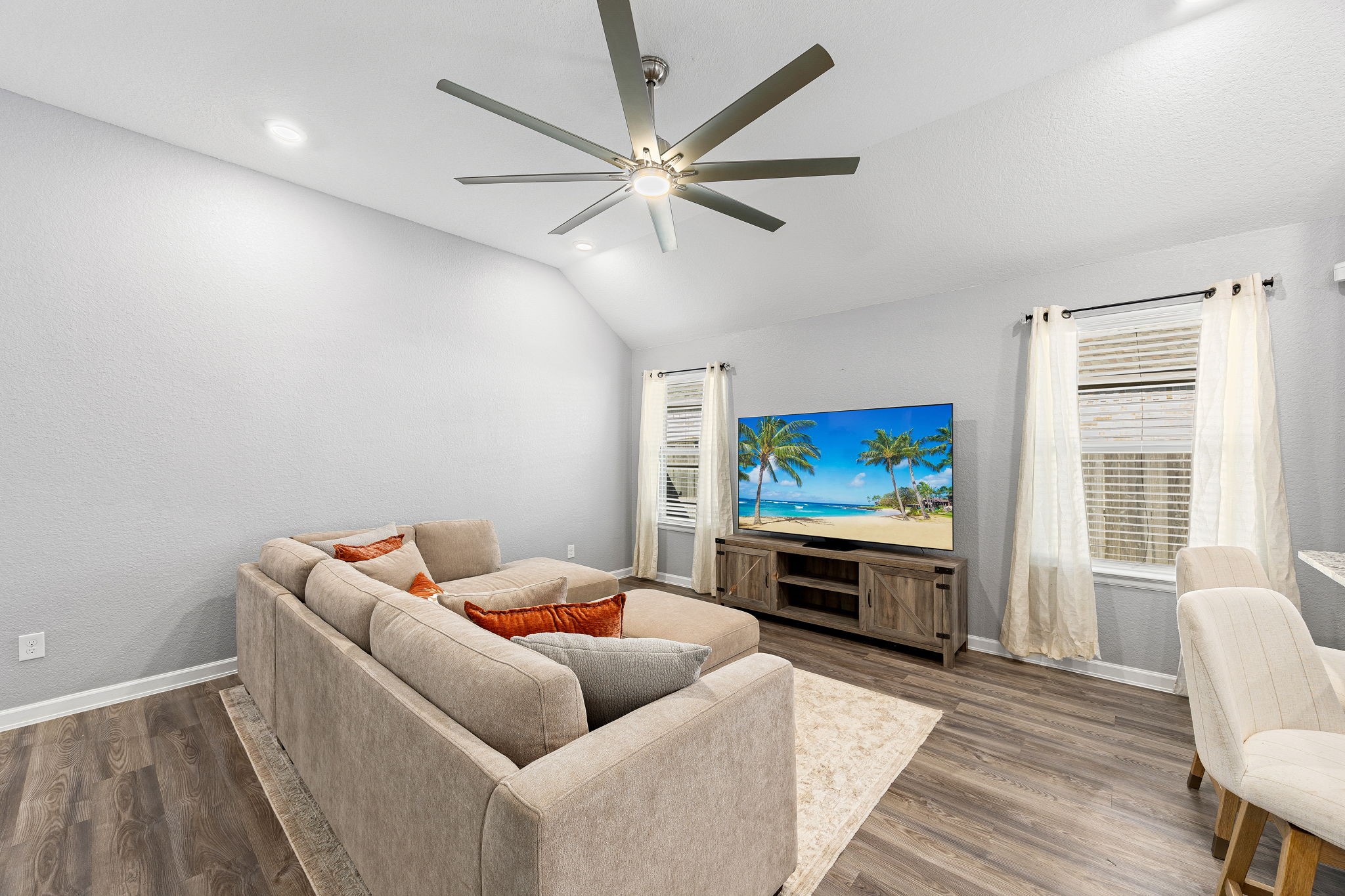 23002 Blackstone Park Road Katy, TX 77493 - Photo 7 of 36 a living room with furniture and a flat screen tv