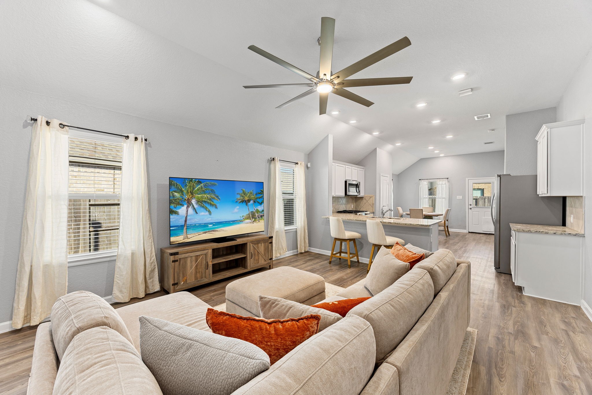 23002 Blackstone Park Road Katy, TX 77493 - Photo 35 of 36 a living room with furniture and a flat screen tv
