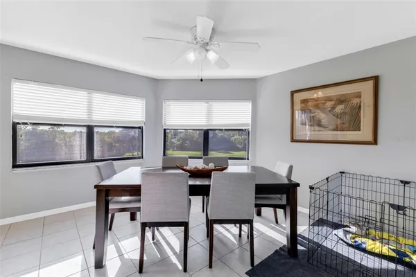 a dining room with furniture and window
