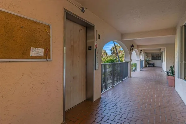 a view of a swimming pool with a lawn chairs and a yard