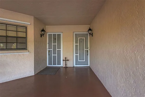 a dining room with furniture window and wooden floor