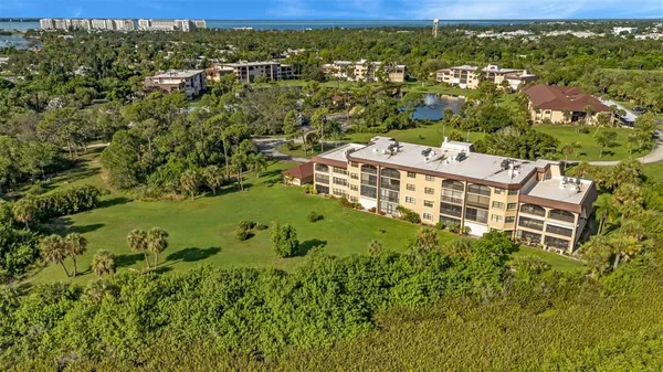 a view of a house with backyard porch and sitting area