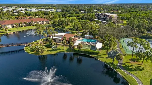 a swimming pool with outdoor seating and yard