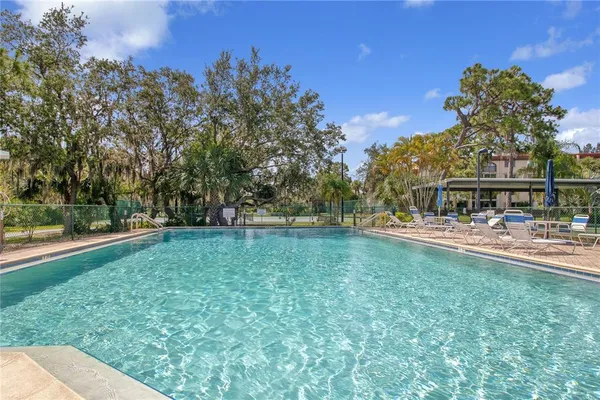a view of swimming pool with a yard