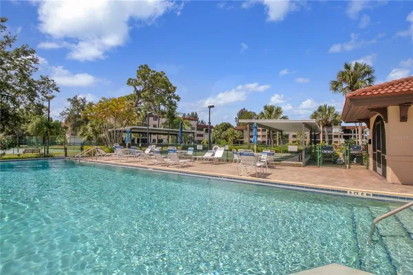 a view of swimming pool from a balcony