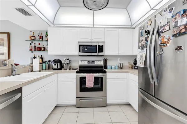 a view of a dining room with furniture and window