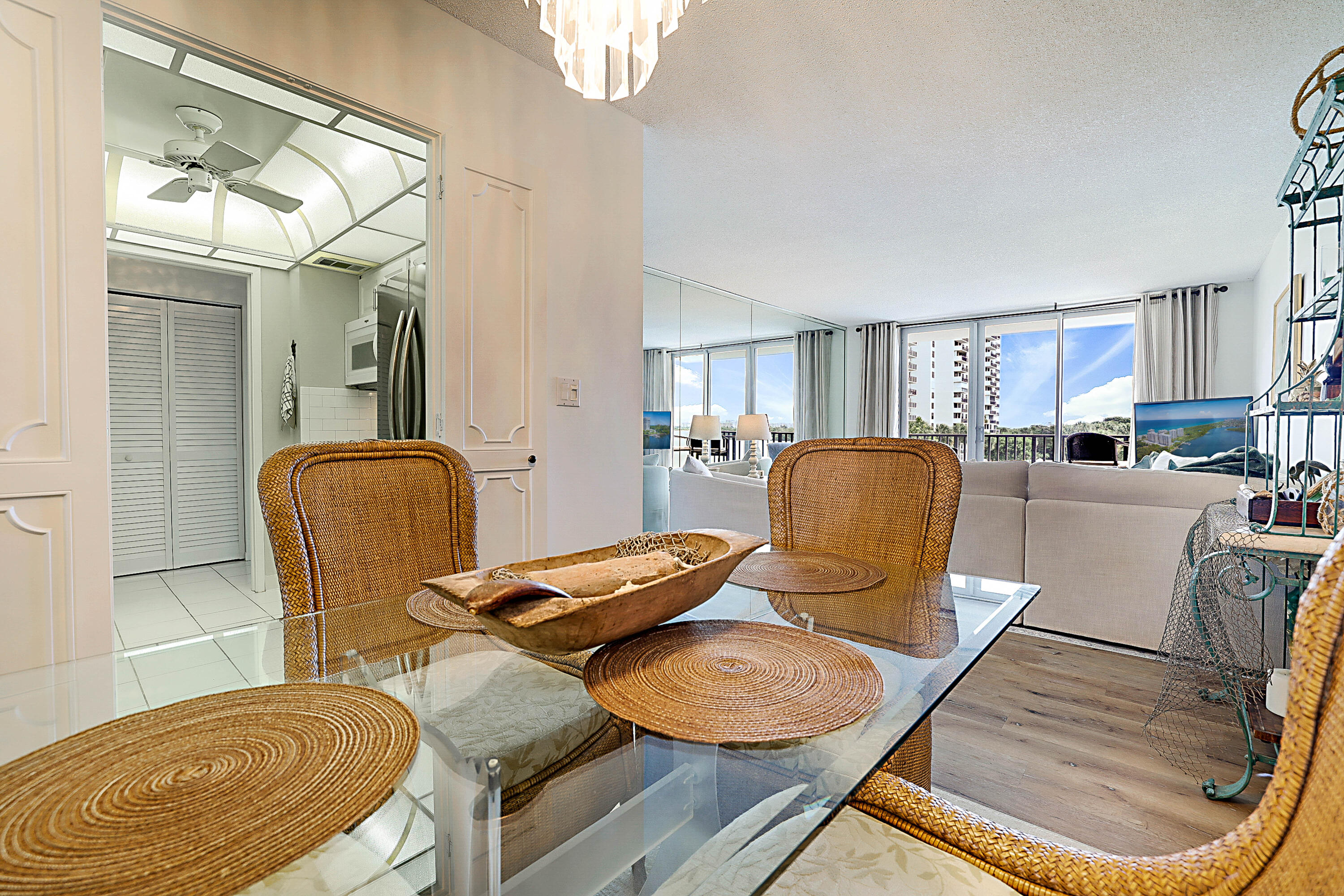 2121 North Ocean Boulevard, Unit 407W Boca Raton, FL 33431 - Photo 14 of 60 a living room with furniture and a dining table