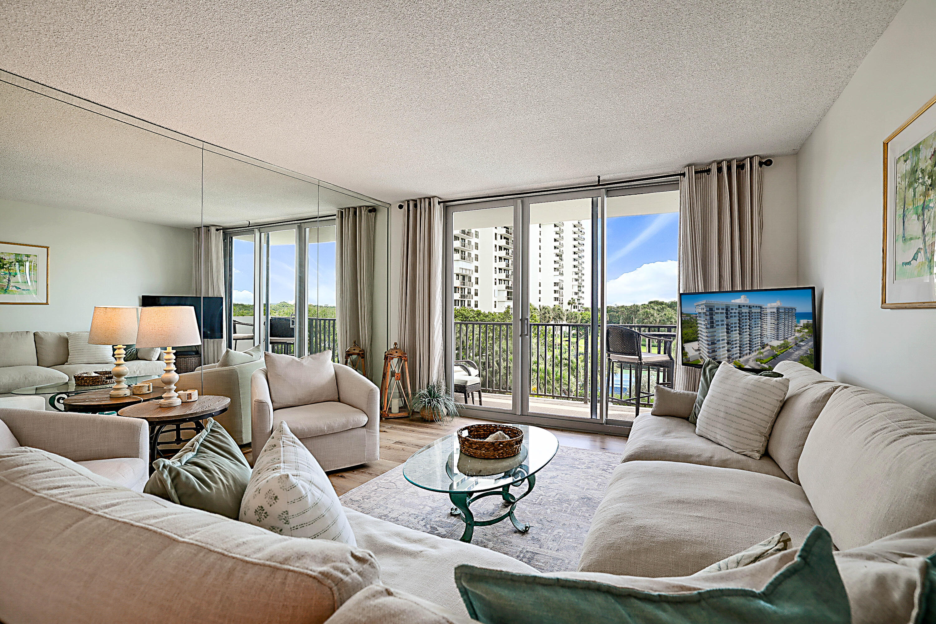 2121 North Ocean Boulevard, Unit 407W Boca Raton, FL 33431 - Photo 7 of 60 a living room with furniture and a large window