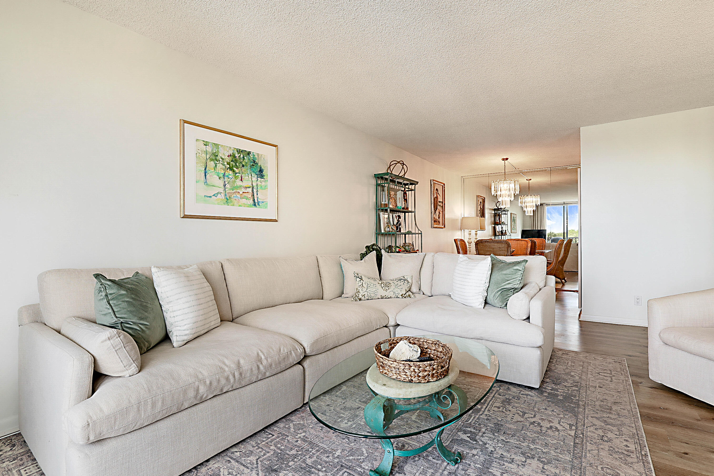 2121 North Ocean Boulevard, Unit 407W Boca Raton, FL 33431 - Photo 8 of 60 a living room with furniture and a wooden floor
