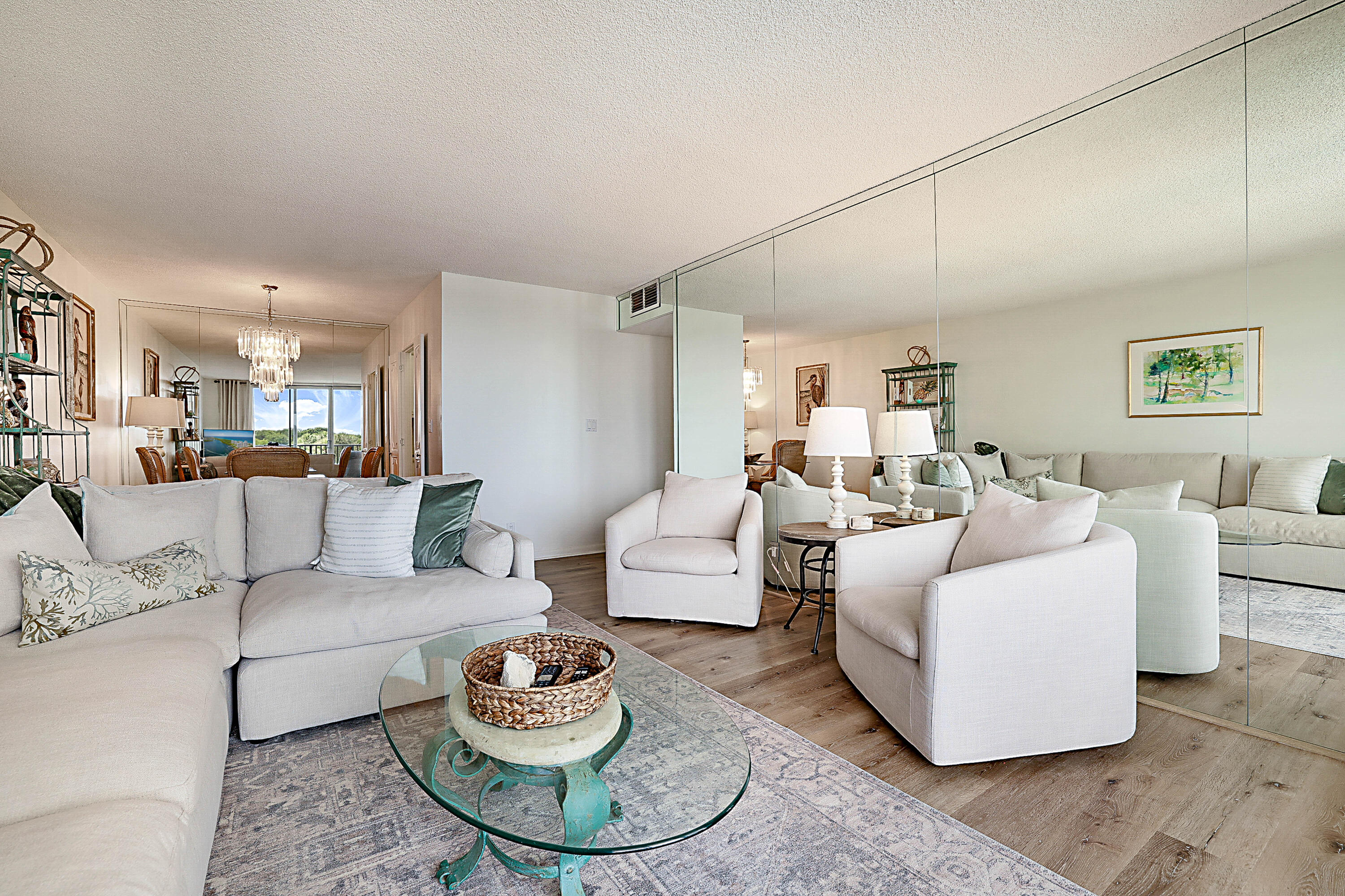 2121 North Ocean Boulevard, Unit 407W Boca Raton, FL 33431 - Photo 9 of 60 a living room with furniture and a table