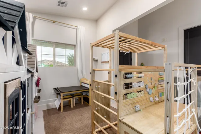 a bed room with a bed and a tv