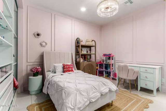 a bedroom with a bed and book shelf