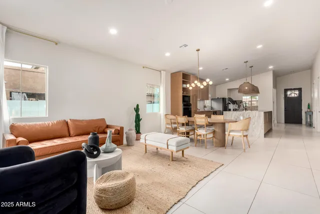 a living room with furniture and a large mirror