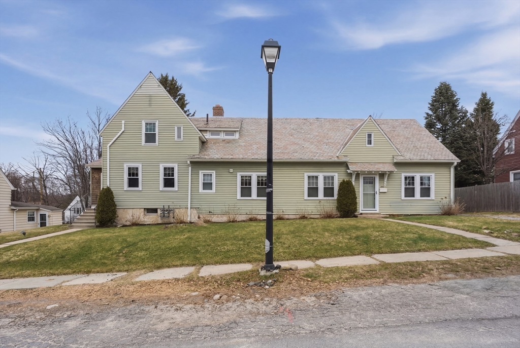 a front view of a house with a yard