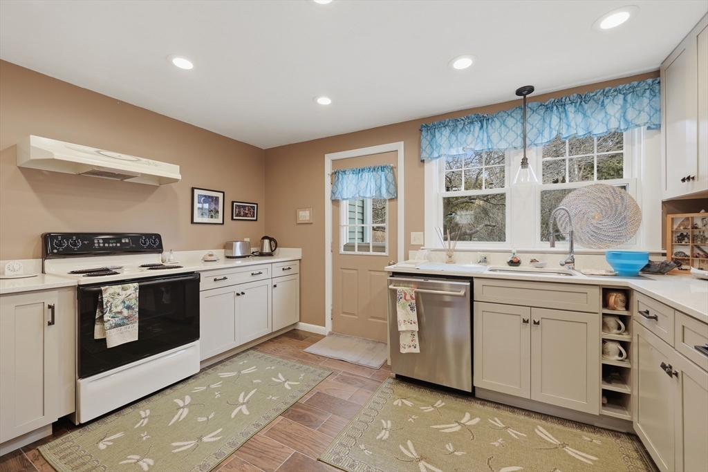 24-26 Watt Road Worcester, MA 01606 - Photo 20 of 41 a kitchen with stainless steel appliances granite countertop a stove and a sink