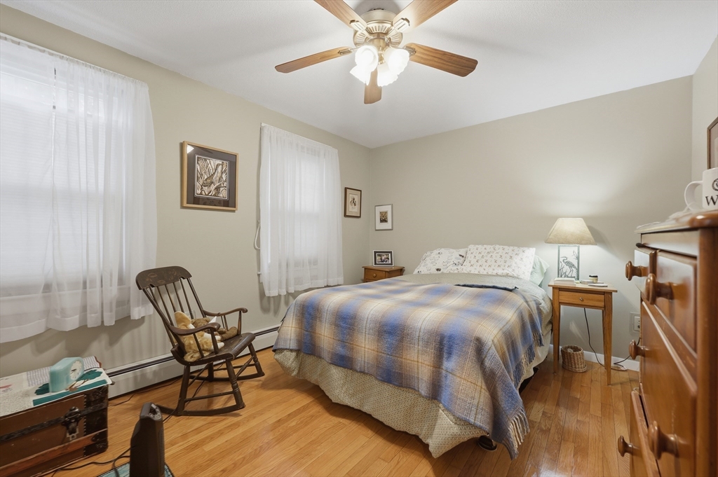 24-26 Watt Road Worcester, MA 01606 - Photo 26 of 41 a bedroom with a bed chairs and a desk