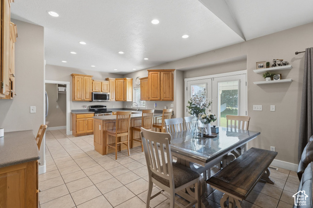 1447 Meadow Lane Mapleton, UT 84664 - Photo 11 of 67 Kitchen with light wood-finish cabinetry, stainless steel appliances, and a central island