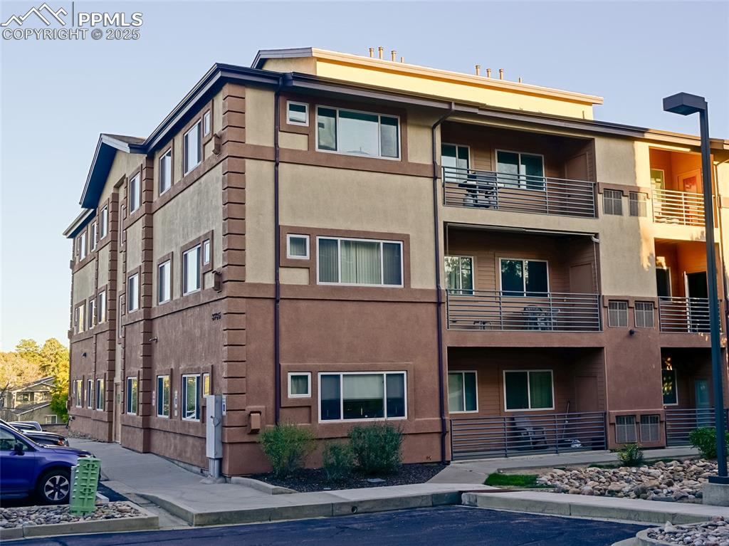 3765 Hartsock Lane, Unit 307 Colorado Springs, CO 80917 - Photo 2 of 37 a front view of residential houses