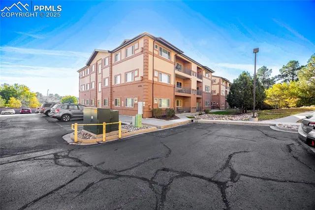 a view of a street with a building in the background