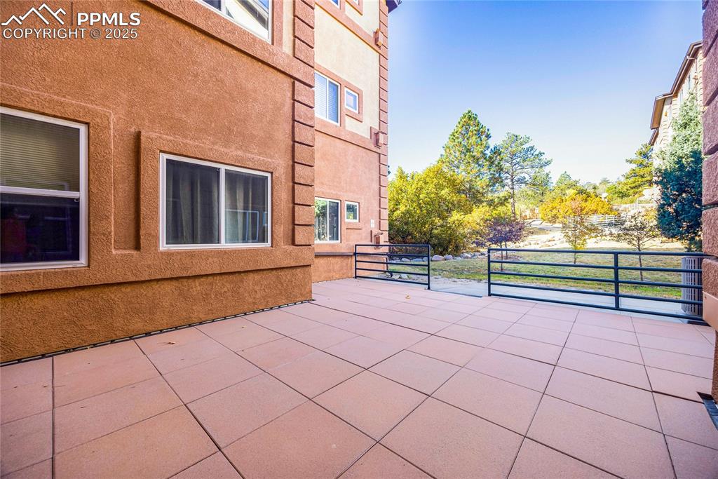 3765 Hartsock Lane, Unit 307 Colorado Springs, CO 80917 - Photo 33 of 37 a view of a terrace with a bench