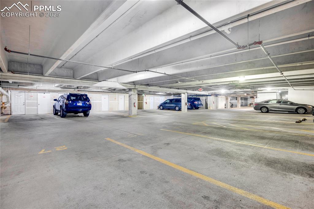 3765 Hartsock Lane, Unit 307 Colorado Springs, CO 80917 - Photo 34 of 37 a view of parking garage with cars