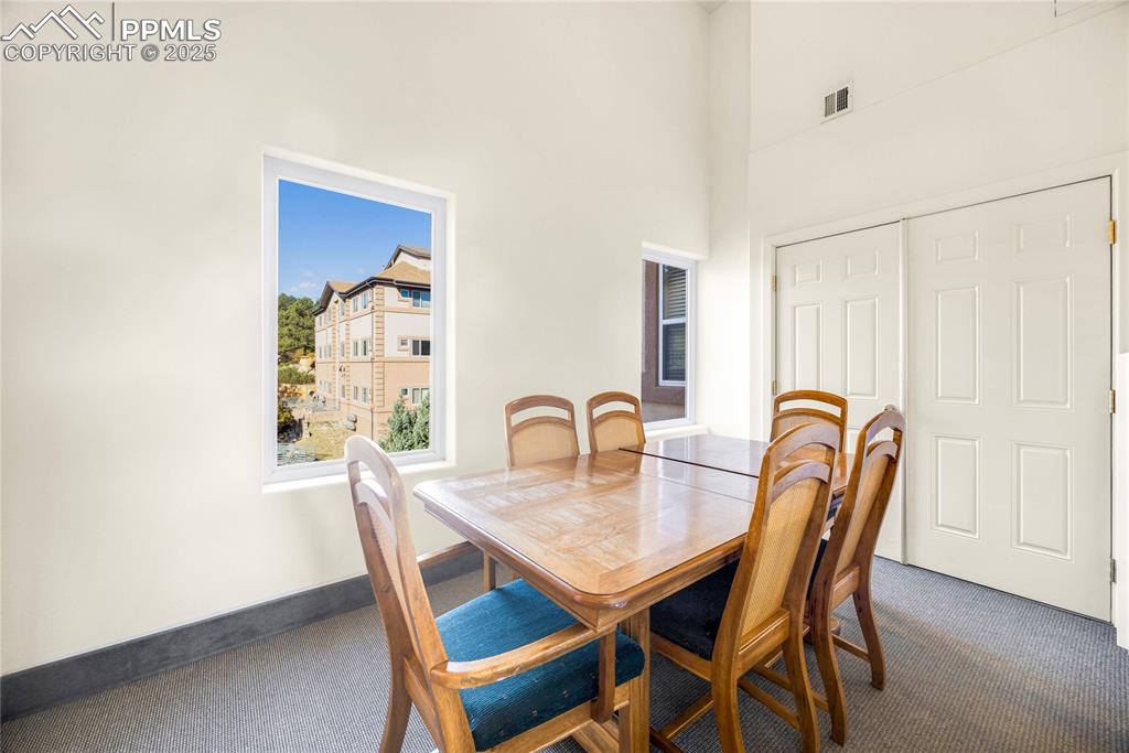 3765 Hartsock Lane, Unit 307 Colorado Springs, CO 80917 - Photo 35 of 37 a dining room with furniture and window