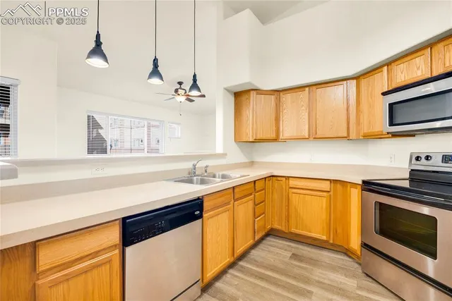 a kitchen that has a sink and a stove