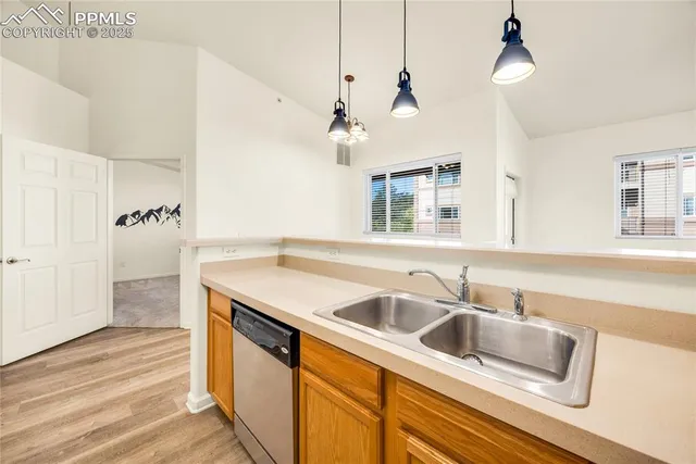 a bathroom with a granite countertop sink mirror vanity and toilet