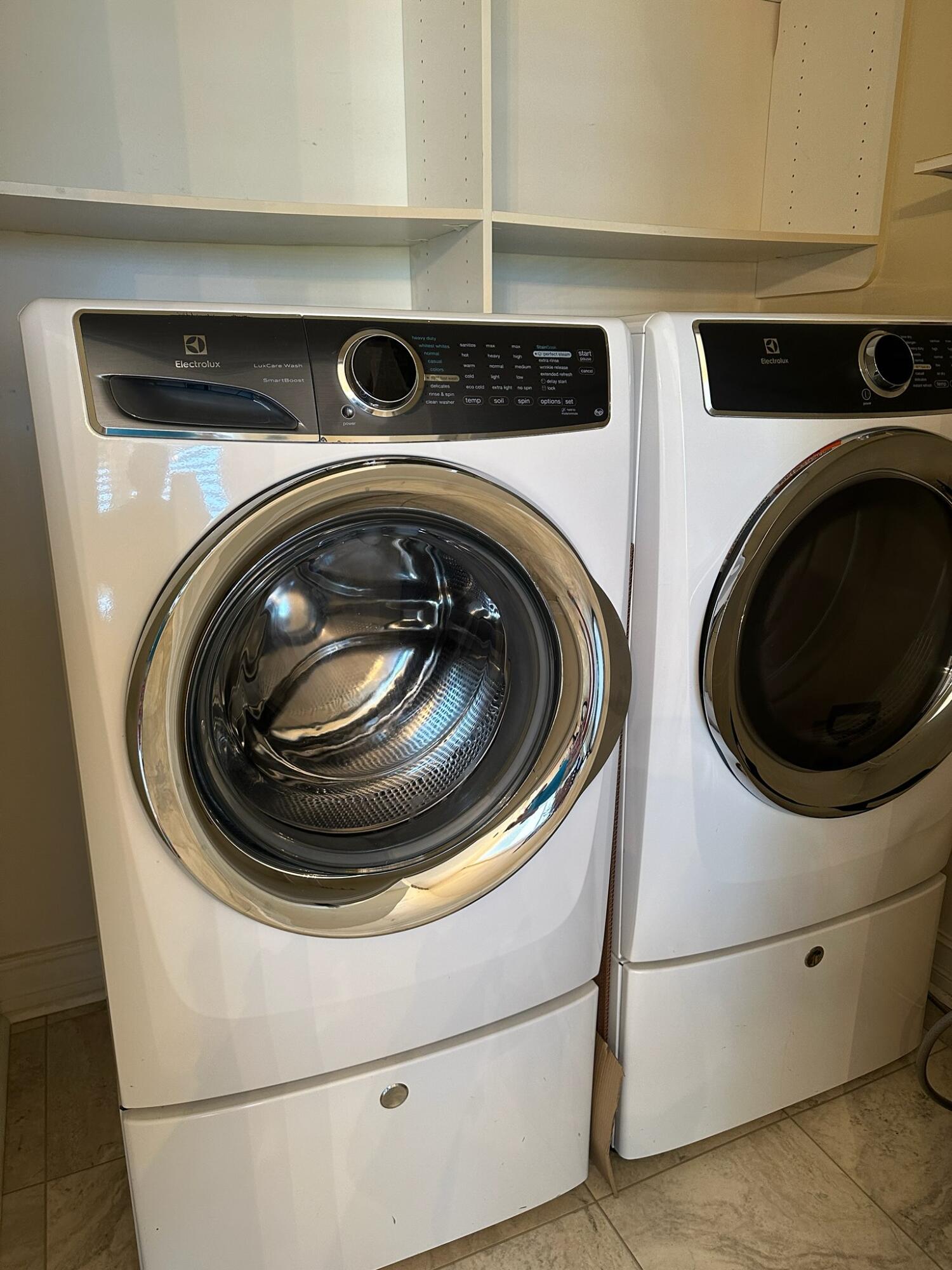2001 Southeast Sailfish Point Boulevard, Unit 316 Stuart, FL 34996 - Photo 19 of 39 a close up view of washer and dryer