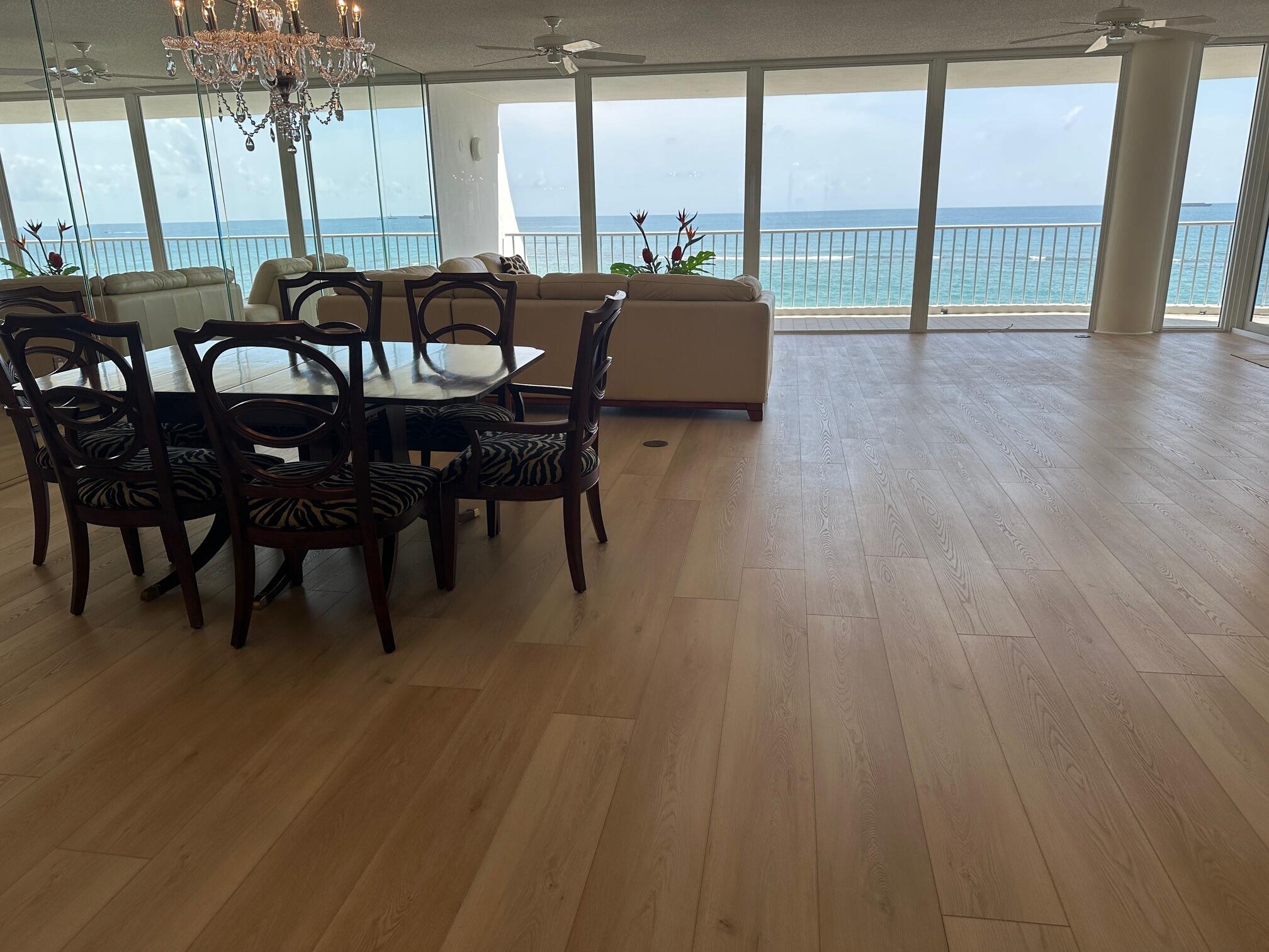 2001 Southeast Sailfish Point Boulevard, Unit 316 Stuart, FL 34996 - Photo 20 of 39 a view of a dining room with furniture window and wooden floor