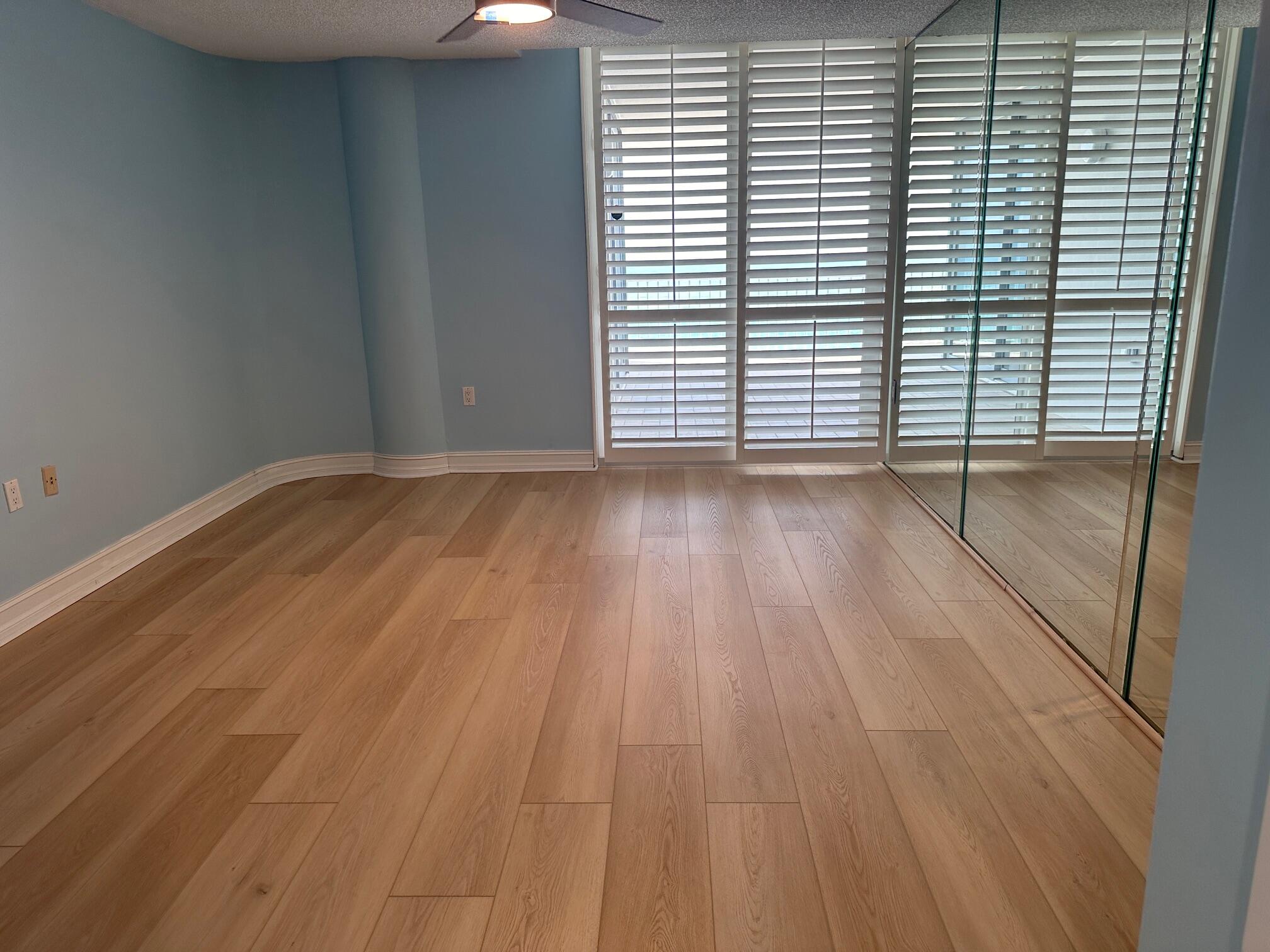 2001 Southeast Sailfish Point Boulevard, Unit 316 Stuart, FL 34996 - Photo 21 of 39 a view of a room with wooden floor and a window
