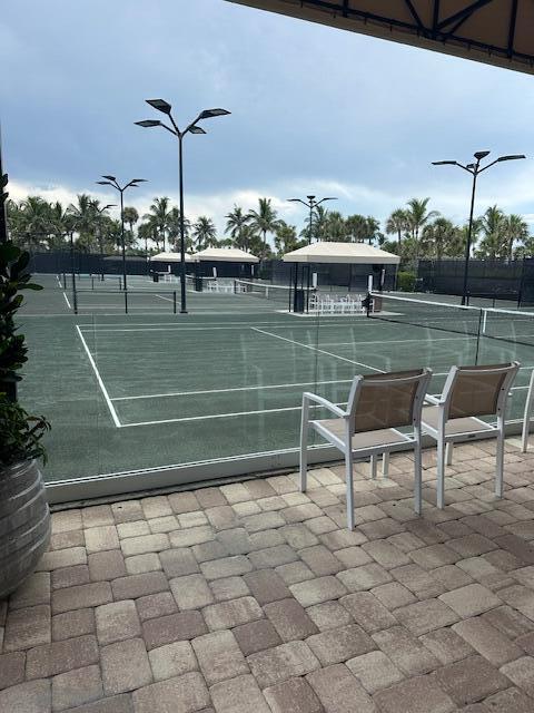 2001 Southeast Sailfish Point Boulevard, Unit 316 Stuart, FL 34996 - Photo 29 of 39 a view of a chairs and table in the patio