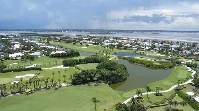 an aerial view of a house with a lake view