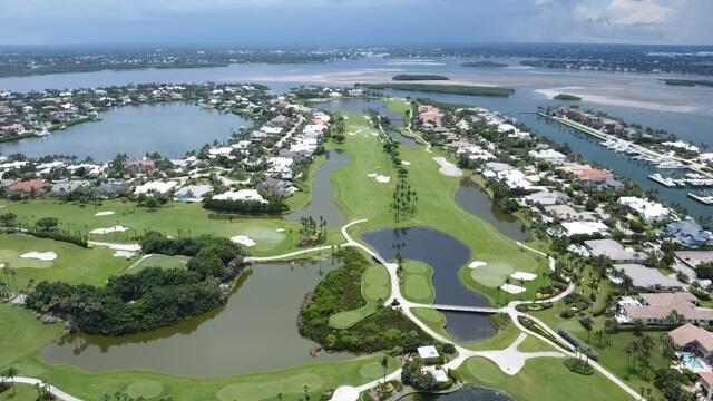 2001 Southeast Sailfish Point Boulevard, Unit 316 Stuart, FL 34996 - Photo 35 of 39 an aerial view of a houses with a lake view