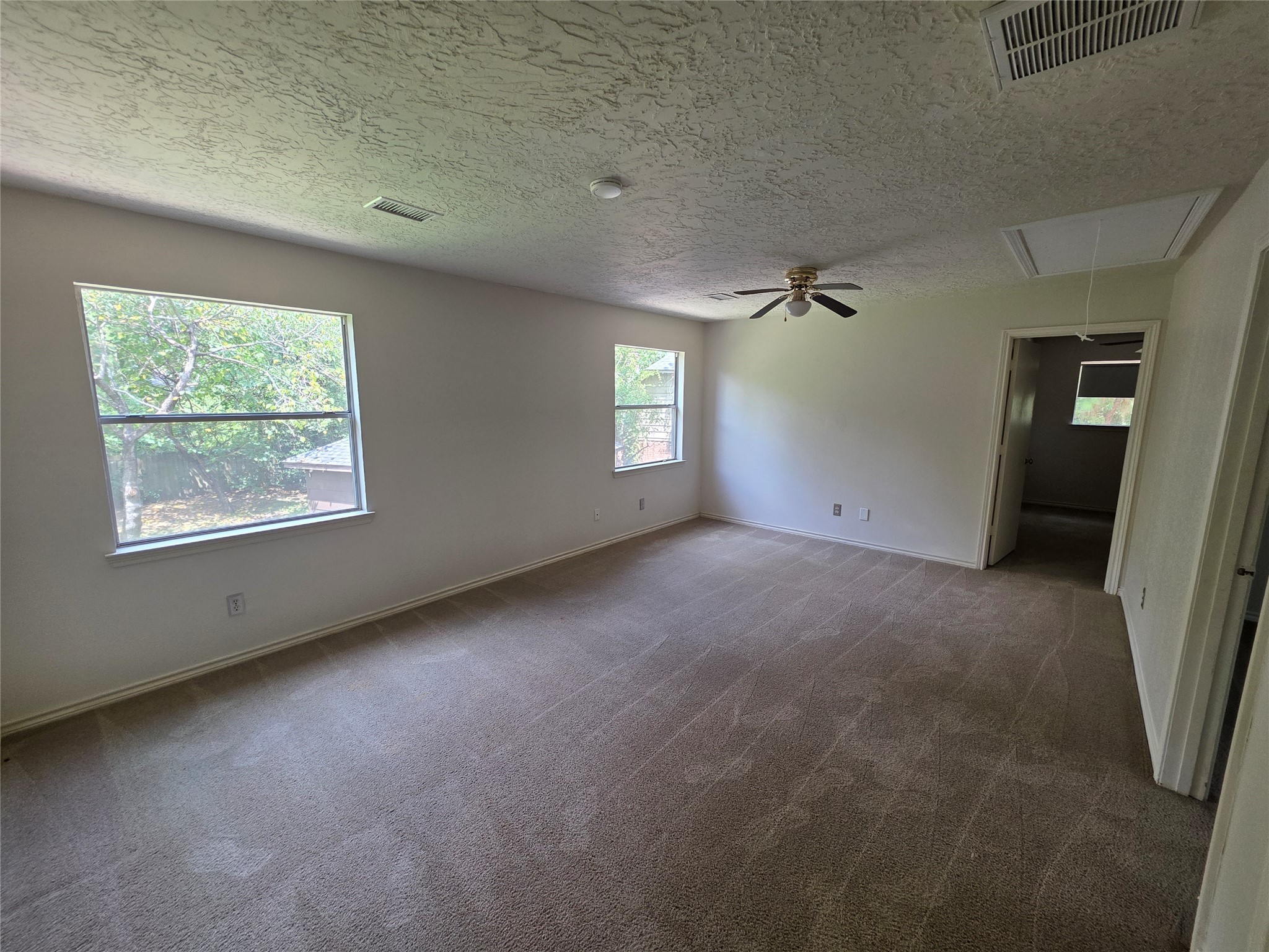 18 Mayfair Grove Court The Woodlands, TX 77381 - Photo 18 of 28 an empty room with windows