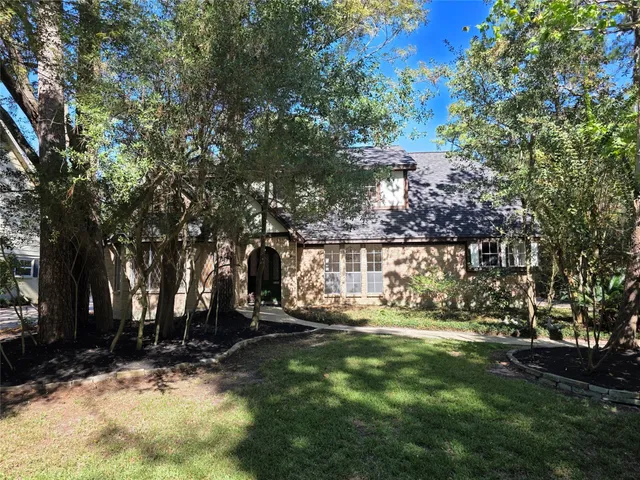 a view of outdoor space with garden and trees