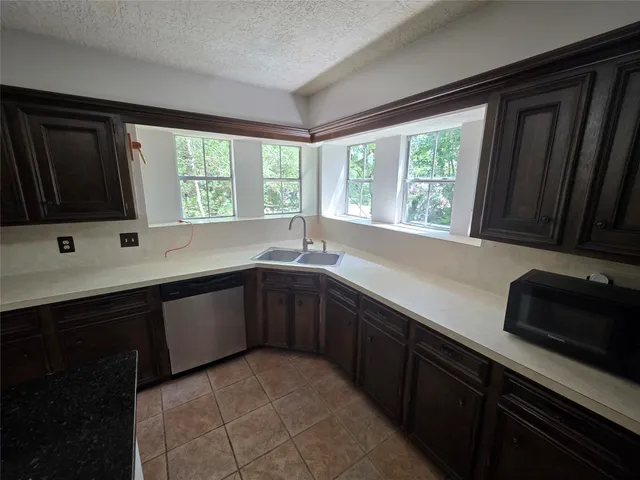 a kitchen with a sink and a window