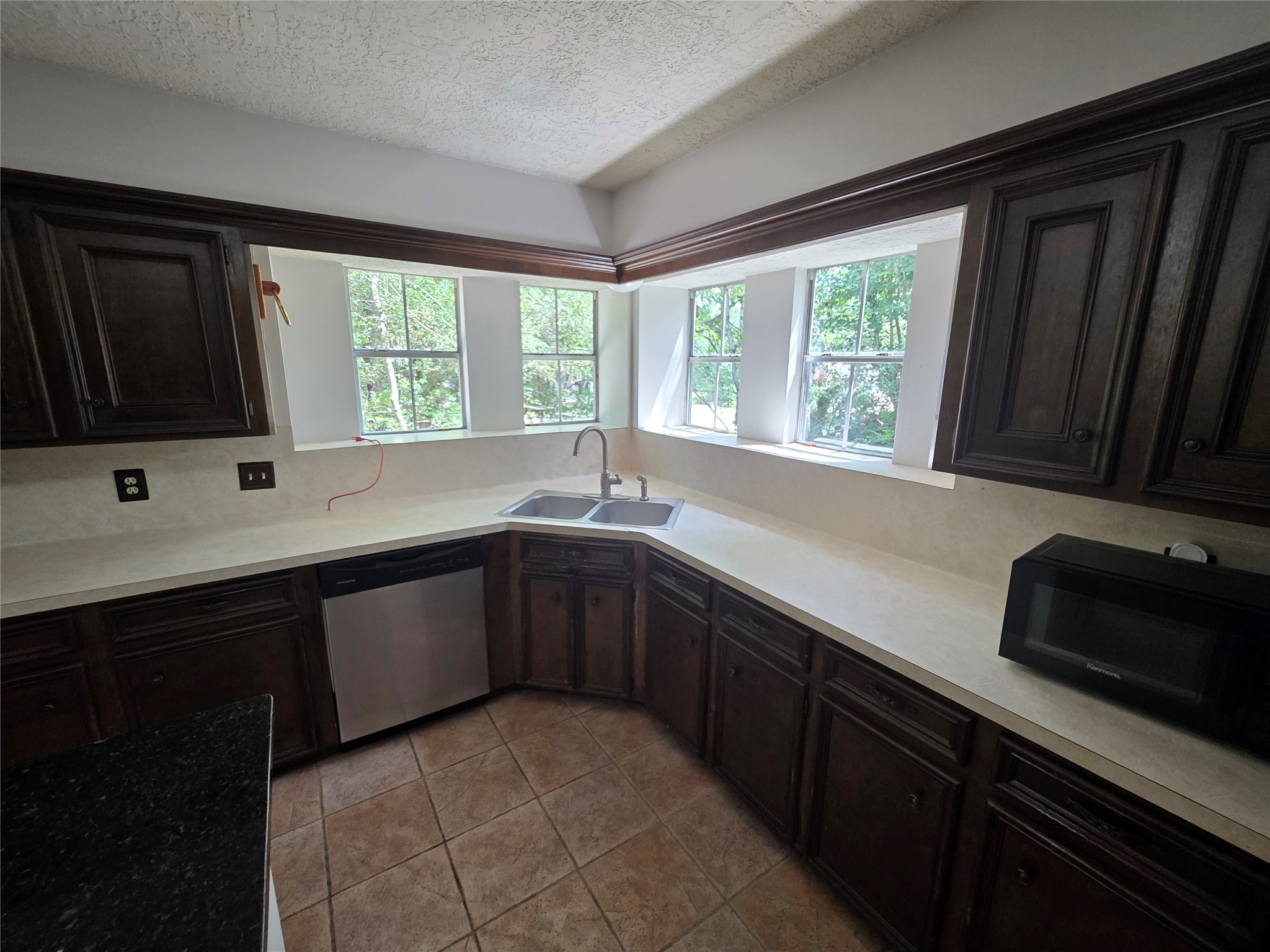 18 Mayfair Grove Court The Woodlands, TX 77381 - Photo 10 of 28 a kitchen with a sink and a window